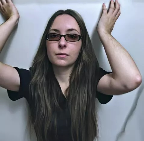 AI Video from prompt: The camera pulls back and shows the girl in full