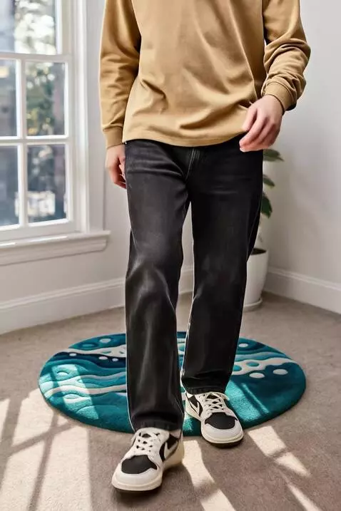 AI Video from prompt: A stylish young man in loose black jeans, mustar
