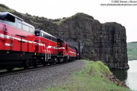AI Video from prompt: A train speeding down the line blasted out of th