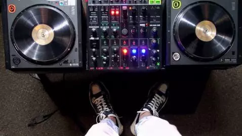 AI Video from prompt: Make a video that shows a DJ playing music and m