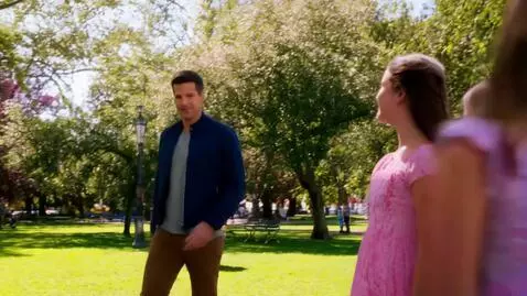 AI Video from prompt: two girl friends walking down the park and a man