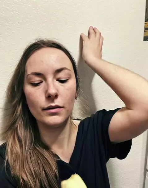 AI Video from prompt: The girl is eating a banana. Hair is visible on 