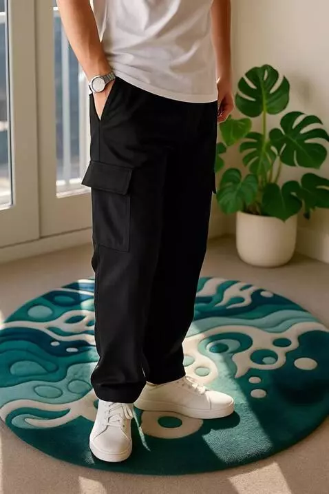 AI Video from prompt: "A man wearing black cargo pants stands confiden