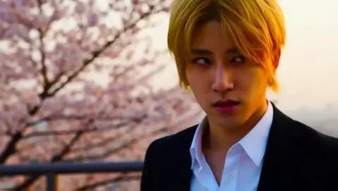 AI Video from prompt: Usui Takumi stands on a sunset-lit balcony, dark