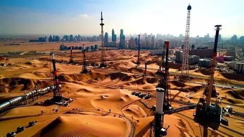 AI Video from prompt: Oil wells in the desert with Dubai in distance