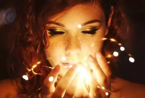 AI Video from prompt: ethereal woman conjures a whirlwind of light fro