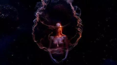 AI Video from prompt: A young woman materializes from swirling, lumino