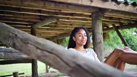 AI Video from prompt: A young beautiful African woman chilling in her 