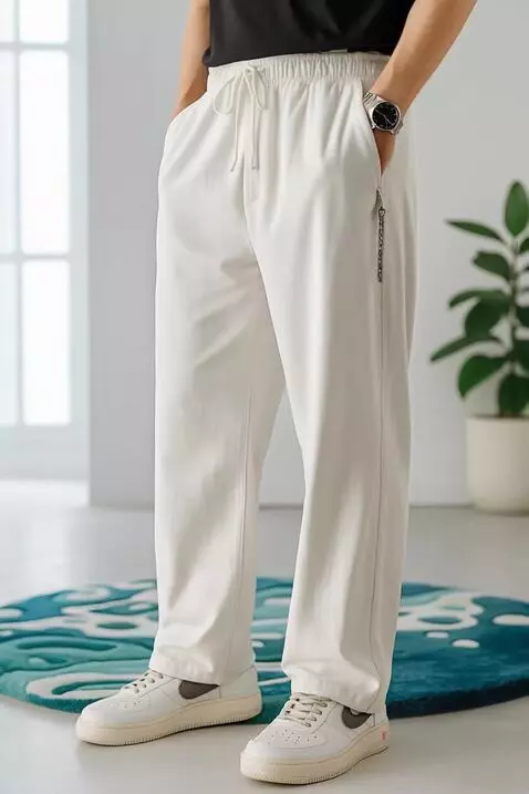 AI Video from prompt: A stylish fashion model wearing ivory-white draw
