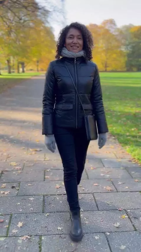 AI Video from prompt: A mature woman in a black nylon bodysuit with sl