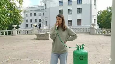 AI Video from prompt: Woman inhale helium from tank and her body gets 