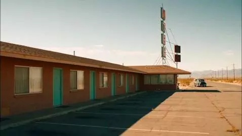 AI Video from prompt: Eye level shot of an old one story motel in the 