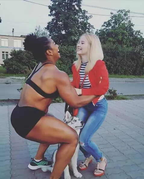 AI Video from prompt: A muscular, tall, amazon girl enters the frame f