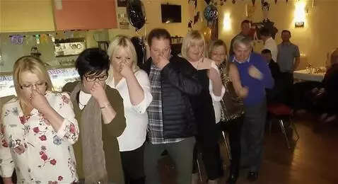 AI Video from prompt: I want everyone in the picture to hold their nos