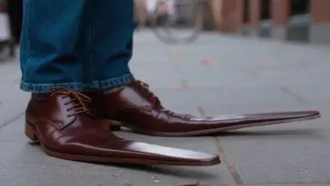 AI Video from prompt: Shoes with very long oar-like noses!