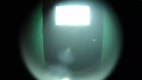 AI Video from prompt: A scary ghostly figure smoothly floats out of a 