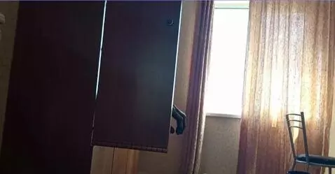 AI Video from prompt: a terrible hand slowly crawls out from behind th