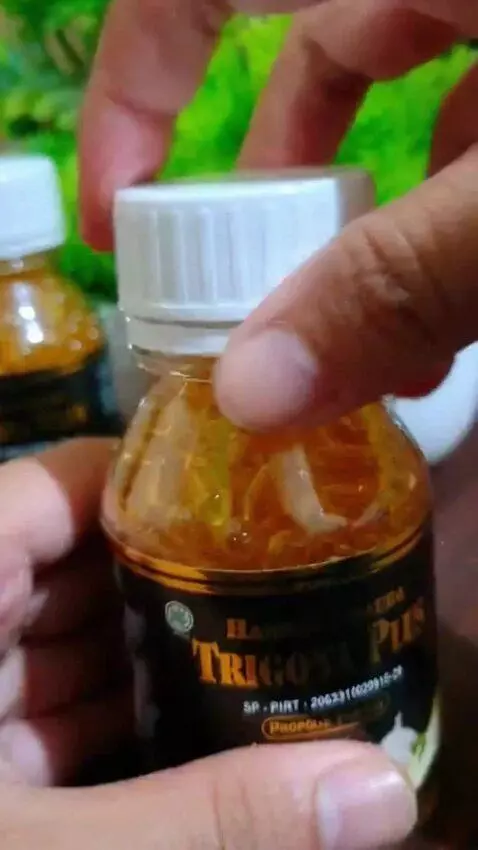 AI Video from prompt: Take one bottle with your hand and place it on t