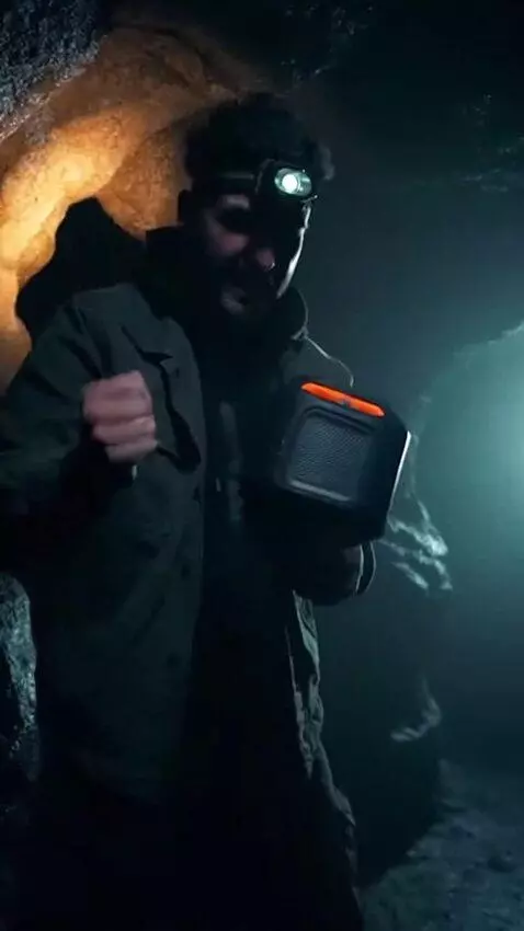 AI Video from prompt: A guy in a dark cave shouts SPIRITS WAKE UP and 