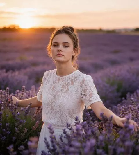 AI Video from prompt: a girl walks across the field, touching the flow