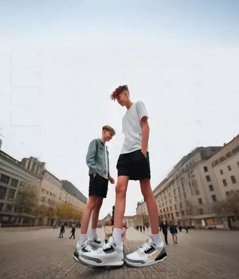 AI Video from prompt: Tallest boy very slowly walking to the building