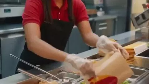 AI Video from prompt: make video of fast food worker making a taco for