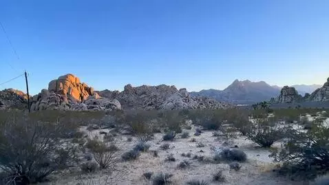 AI Video from prompt: the camera sweeps to the right revealing more of