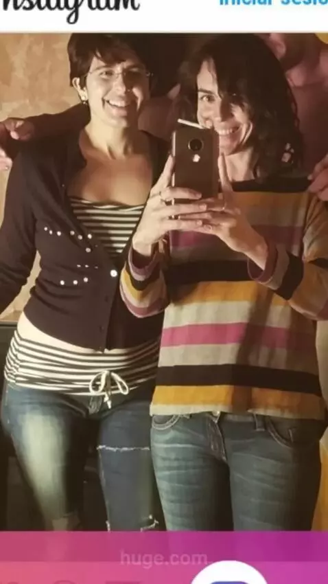 AI Video from prompt: A muscular man hugs the two women from behind