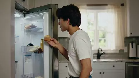 AI Video from prompt: The setting is a contemporary suburban kitchen. 