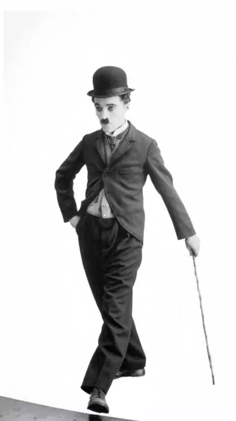 AI Video from prompt: A flash of light and Charlie Chaplin emerges fro