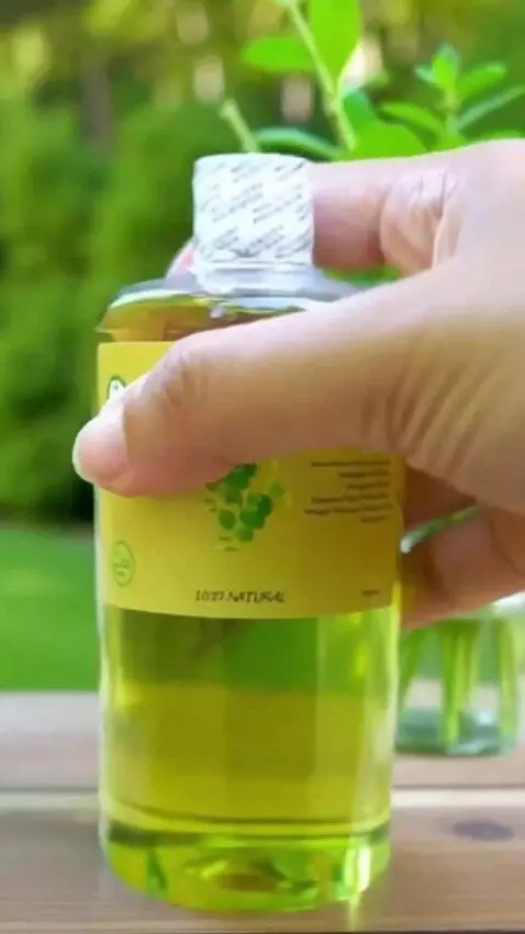 AI Video from prompt: A bottle of Bidara oil slowly rotates while movi