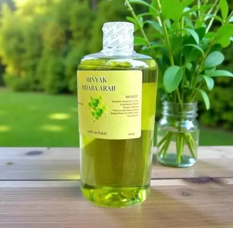 AI Video from prompt: A premium bottle of Bidara oil stands on a woode