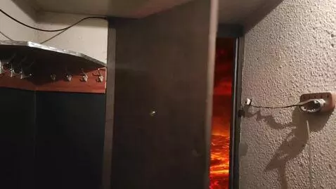 AI Video from prompt: The door opens and there's hell in it