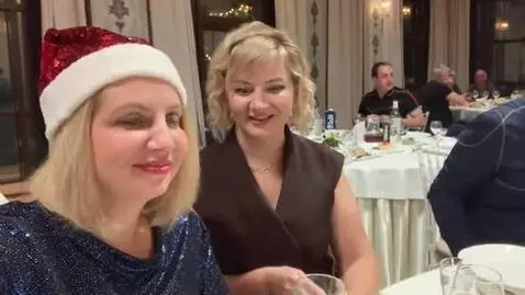 AI Video from prompt: A woman in a black dress jumps, and her bust fal