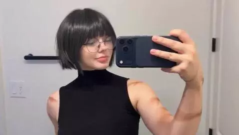 AI Video from prompt: “colossal woman slowly sitting on top of a dense