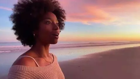 AI Video from prompt: black woman, at a beach, growth huge breast, sur