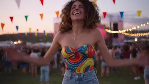 AI Video from prompt: A beautiful woman wearing a v-neck tube top jump