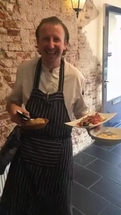AI Video from prompt: Make this chef dance when holding his plates. Ma