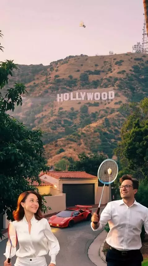 AI Video from prompt: A man and a woman are playing badminton outdoors
