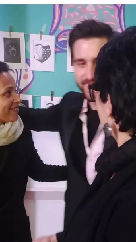 AI Video from prompt: An attractive man hugs both woman