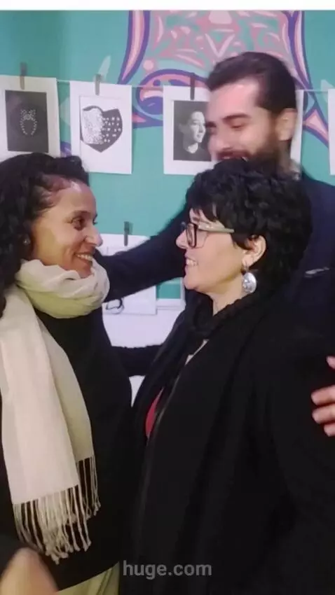 AI Video from prompt: An attractive man hugs both women