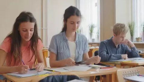 AI Video from prompt: Indian woman teaching in college full of student