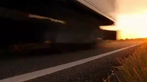 AI Video from prompt: A large delivery truck labeled "BEE HAPPY" on it