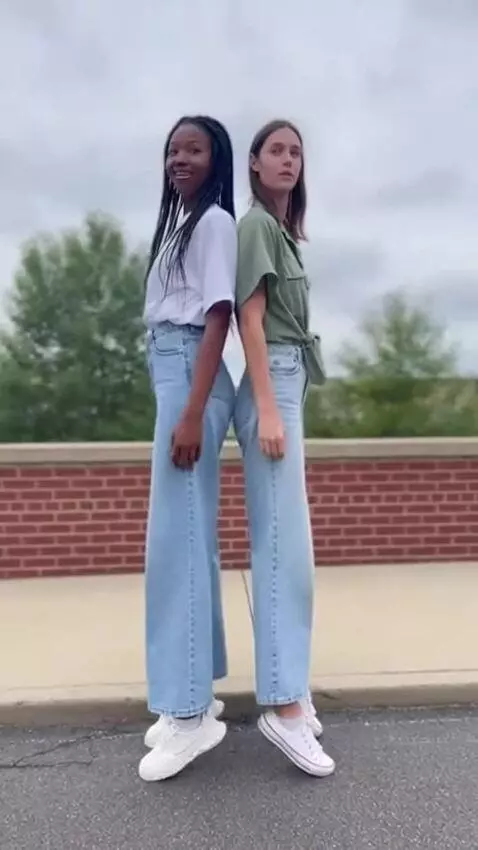 AI Video from prompt: Two tall girls height comparison back to back (o