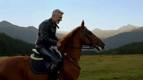AI Video from prompt: Man, gray hair, gray stubble, black leather jack