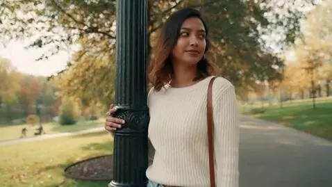 AI Video from prompt: A beautiful 20 years old woman  is standing  by 