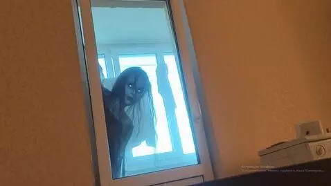 AI Video from prompt: To the right, a scary poltergeist slowly peeks o