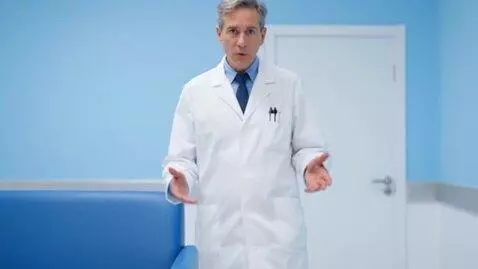 AI Video from prompt: Is the doctor in the photo coming closer, talkin