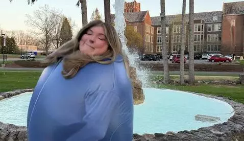 AI Video from prompt: Woman grows a big pregnant belly