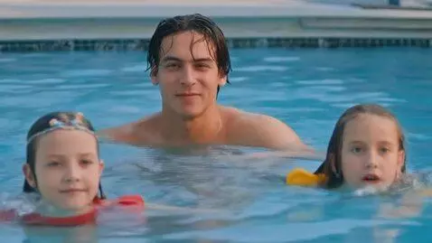 AI Video from prompt: A young man and a girl doing swimming